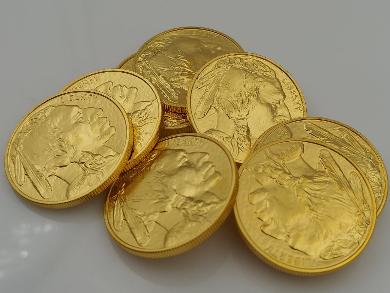 Gold coins with a portrait on a gray background