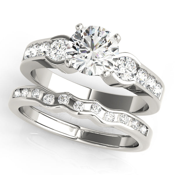 Round Three-Stone Diamond Engagement Ring · 0.54 ct tw
