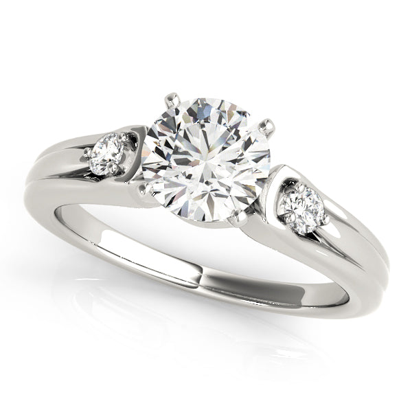Round Three-Stone Diamond Engagement Ring · 0.10 ct tw