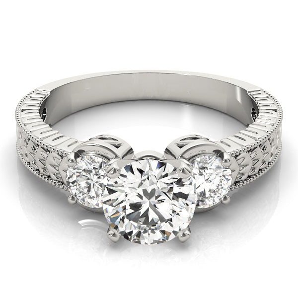 Round Three-Stone Diamond Engagement Ring · 0.30 ct tw