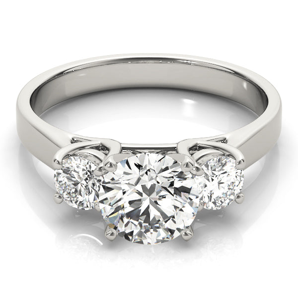 Round Three-Stone Diamond Engagement Ring · 0.20 ct tw