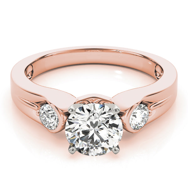 Round Three-Stone Diamond Engagement Ring · 0.20 ct tw