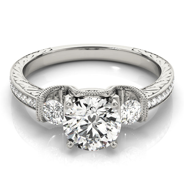 Round Three-Stone Diamond Engagement Ring · 0.34 ct tw