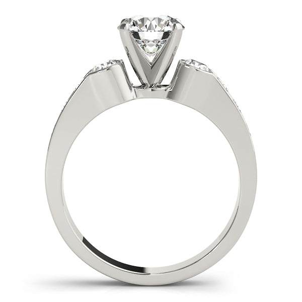 Round Three-Stone Diamond Engagement Ring · 0.54 ct tw