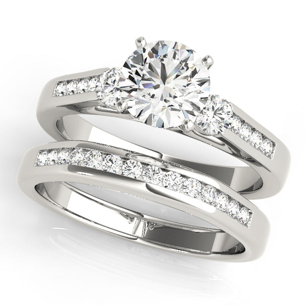 Round Three-Stone Diamond Engagement Ring · 0.44 ct tw