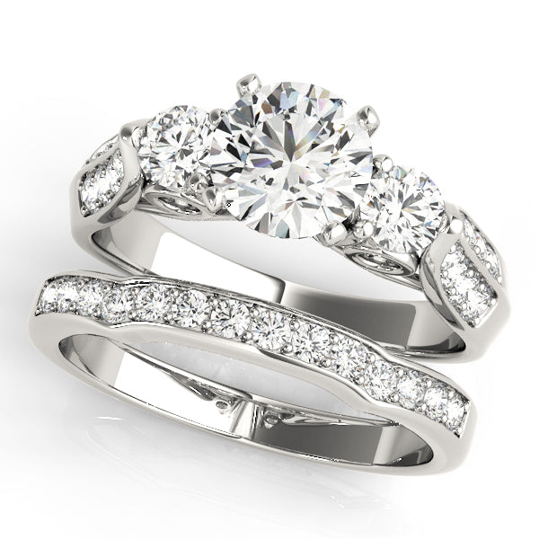 Round Three-Stone Diamond Engagement Ring · 0.65 ct tw
