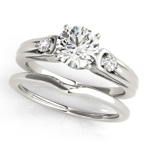 Round Three-Stone Diamond Engagement Ring · 0.10 ct tw