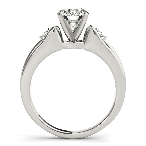 Round Three-Stone Diamond Engagement Ring · 0.10 ct tw