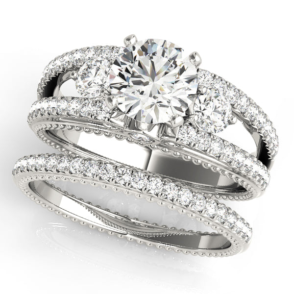 Round Three-Stone Diamond Engagement Ring · 0.51 ct tw