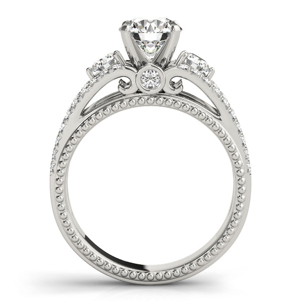 Round Three-Stone Diamond Engagement Ring · 0.51 ct tw