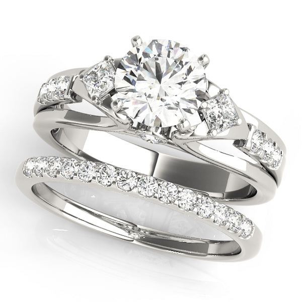 Round Three-Stone Diamond Engagement Ring · 0.29 ct tw