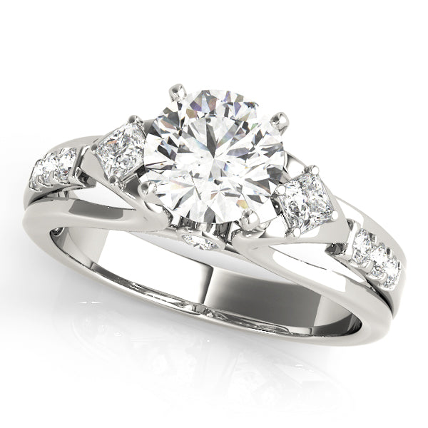 Round Three-Stone Diamond Engagement Ring · 0.29 ct tw