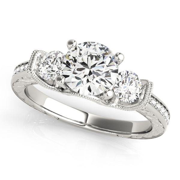 Round Three-Stone Diamond Engagement Ring · 0.72 ct tw