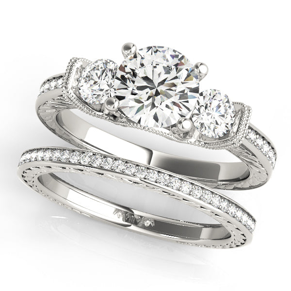 Round Three-Stone Diamond Engagement Ring · 1.95 ct tw