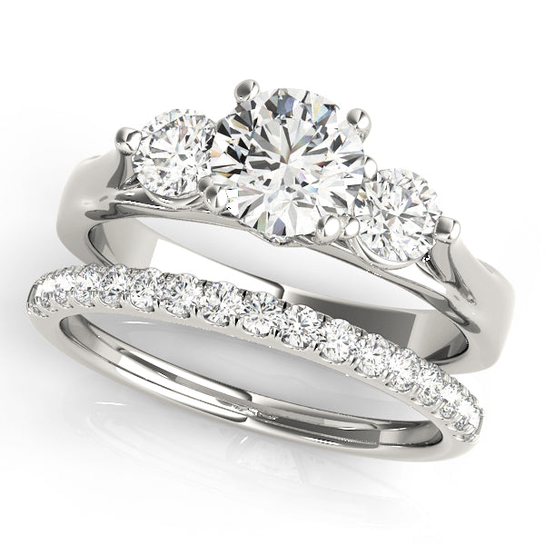 Round Three-Stone Diamond Engagement Ring · 0.43 ct tw