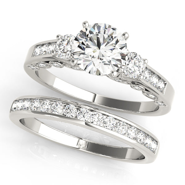 Round Three-Stone Diamond Engagement Ring · 0.44 ct tw