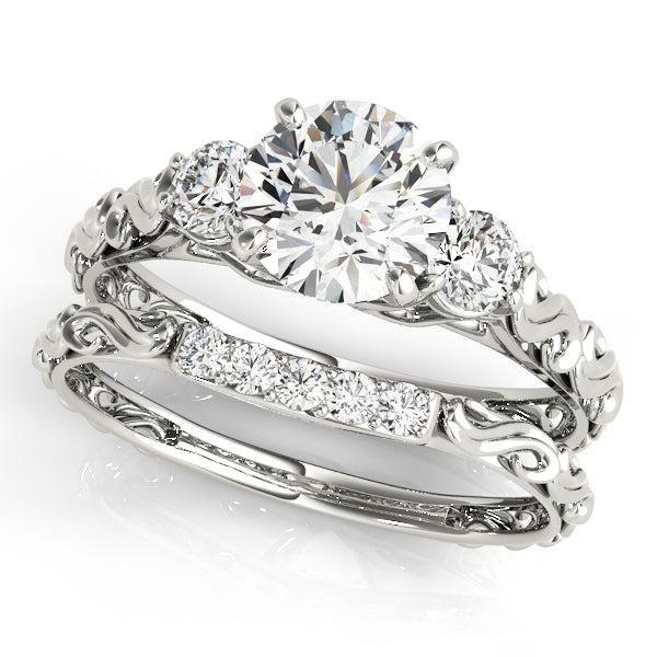 Round Three-Stone Diamond Engagement Ring · 0.24 ct tw