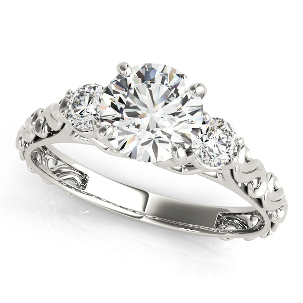 Round Three-Stone Diamond Engagement Ring · 0.24 ct tw