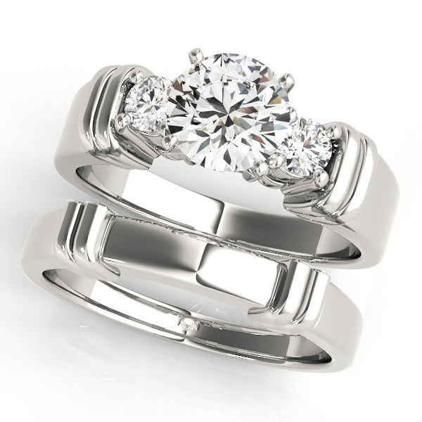Round Three-Stone Diamond Engagement Ring · 0.24 ct tw