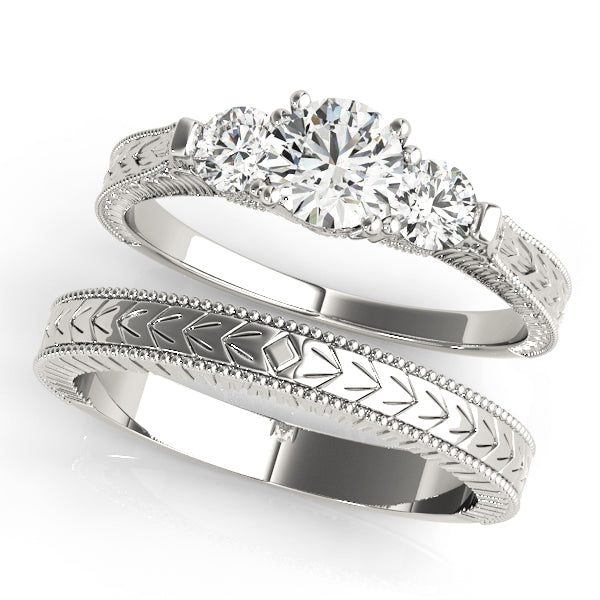 Round Three-Stone Diamond Engagement Ring · 0.82 ct tw