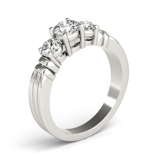 Round Three-Stone Diamond Engagement Ring · 0.24 ct tw