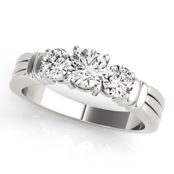 Round Three-Stone Diamond Engagement Ring · 0.24 ct tw