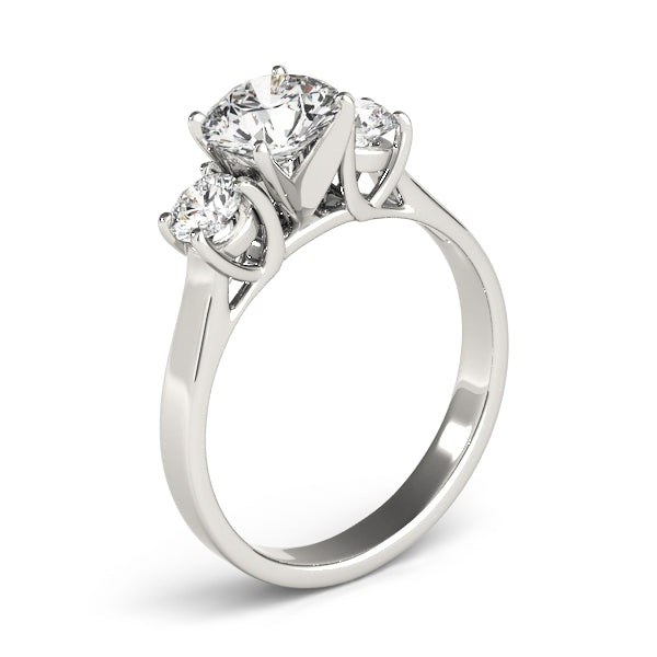 Round Three-Stone Diamond Engagement Ring · 0.20 ct tw