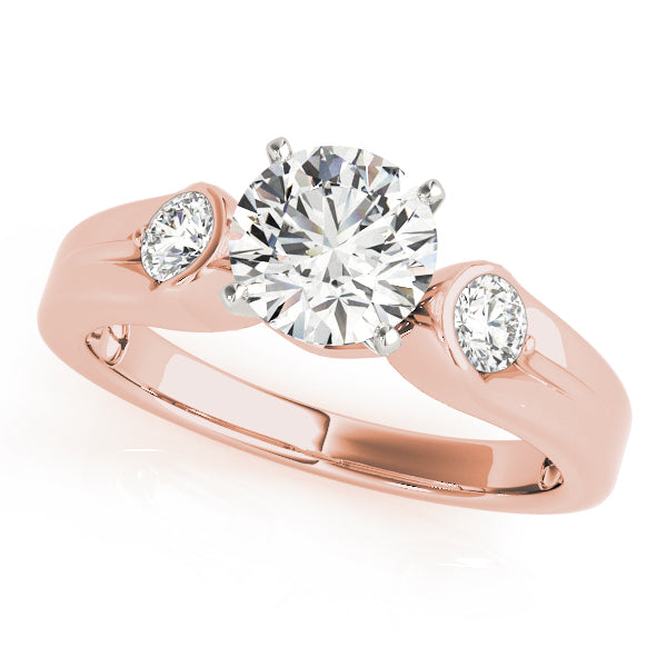 Round Three-Stone Diamond Engagement Ring · 0.20 ct tw