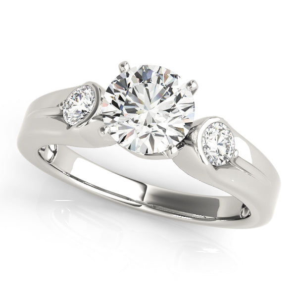Round Three-Stone Diamond Engagement Ring · 0.20 ct tw