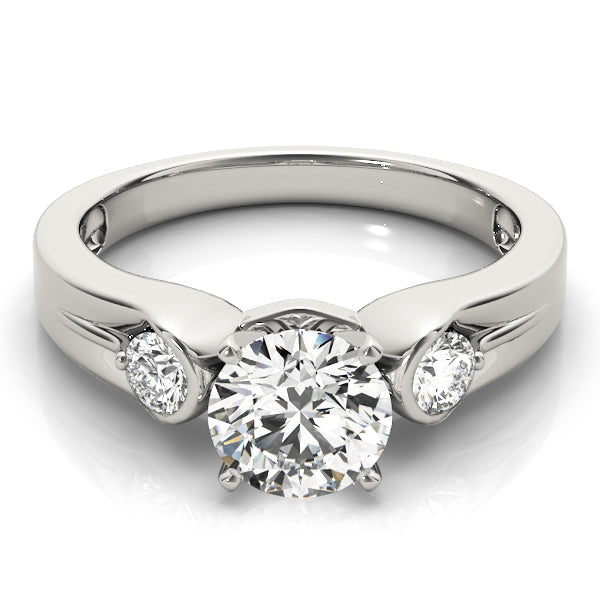 Round Three-Stone Diamond Engagement Ring · 0.20 ct tw