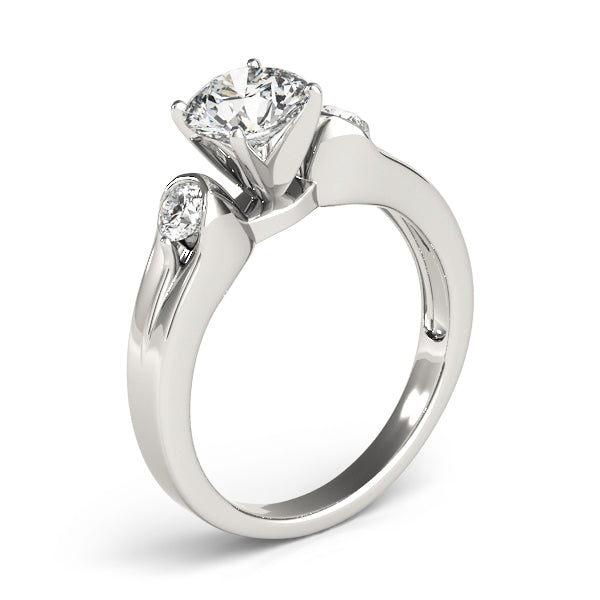 Round Three-Stone Diamond Engagement Ring · 0.20 ct tw