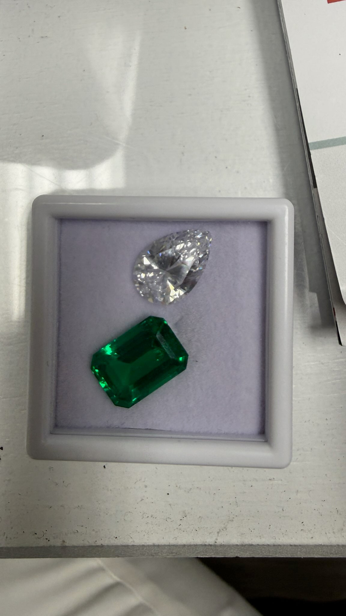 Loose pear diamond and emerald
