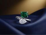 Two-stone emerald and pear bypass ring