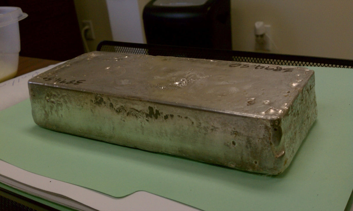 A poured silver bar on the intake bench